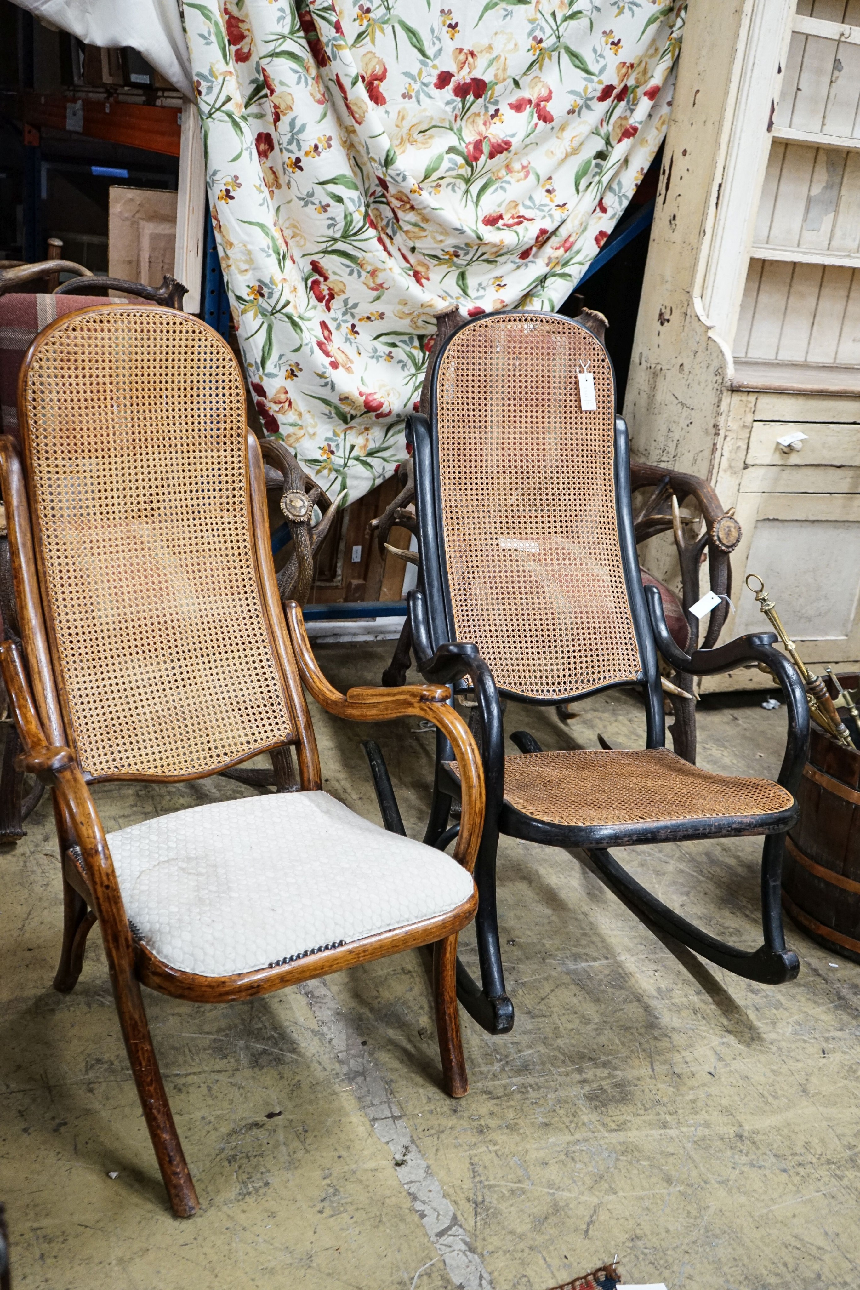 An ebonised Thonet-style caned Bentwood rocking chair and one other bentwood chair